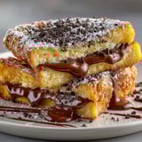 A plate of chocolate covered brioche.